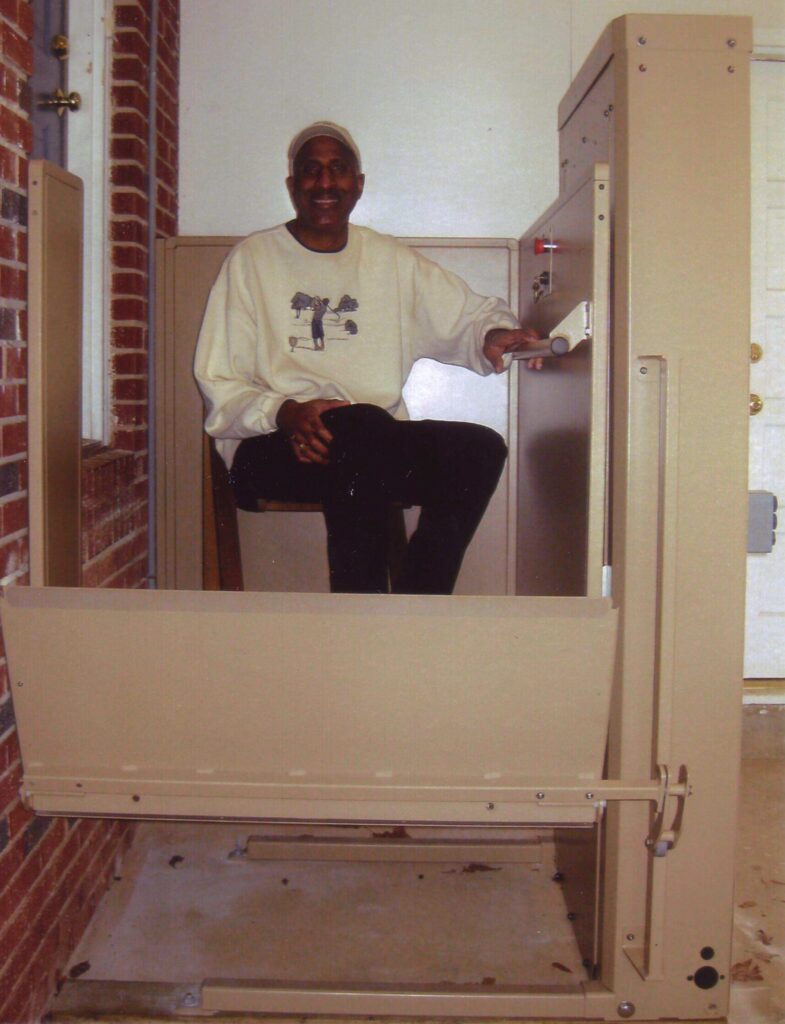Smiling man using his new platform lift